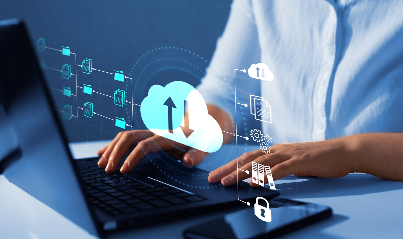 Visualization depicting cloud application development. A person is using a laptop.